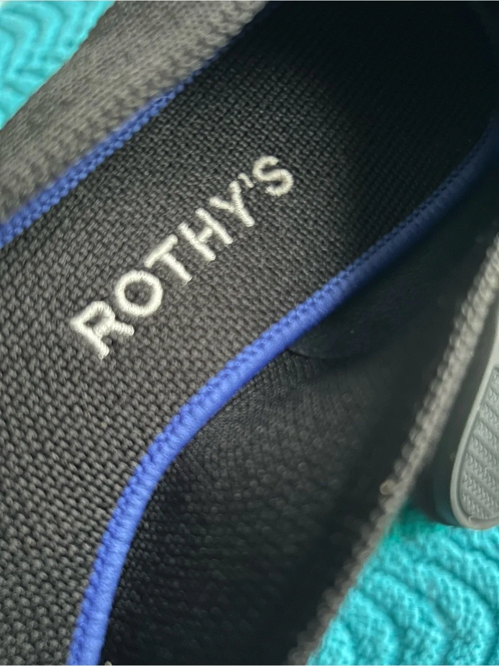 Rothy's Black Pointed Flats with Blue Trim